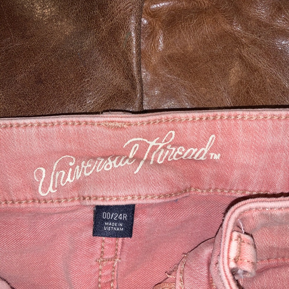 Light baby pink skinny jeans , mid rise